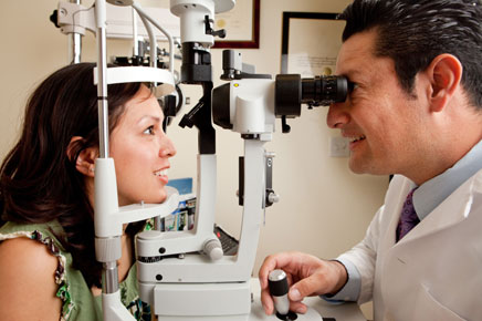 photo: woman having eye exam