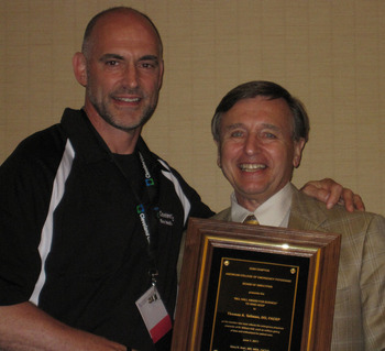 Dr. Lukens presents Dr. Tom Tallman with the Bill Hall Award