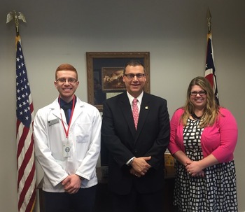 UT student pharmacist Abraham Abdulsalam, Representative Ron Hood R- Ashville & OPA Board Trustee Brigid Groves