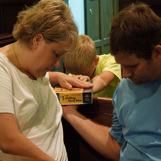 Family Praying With Bible 3x3